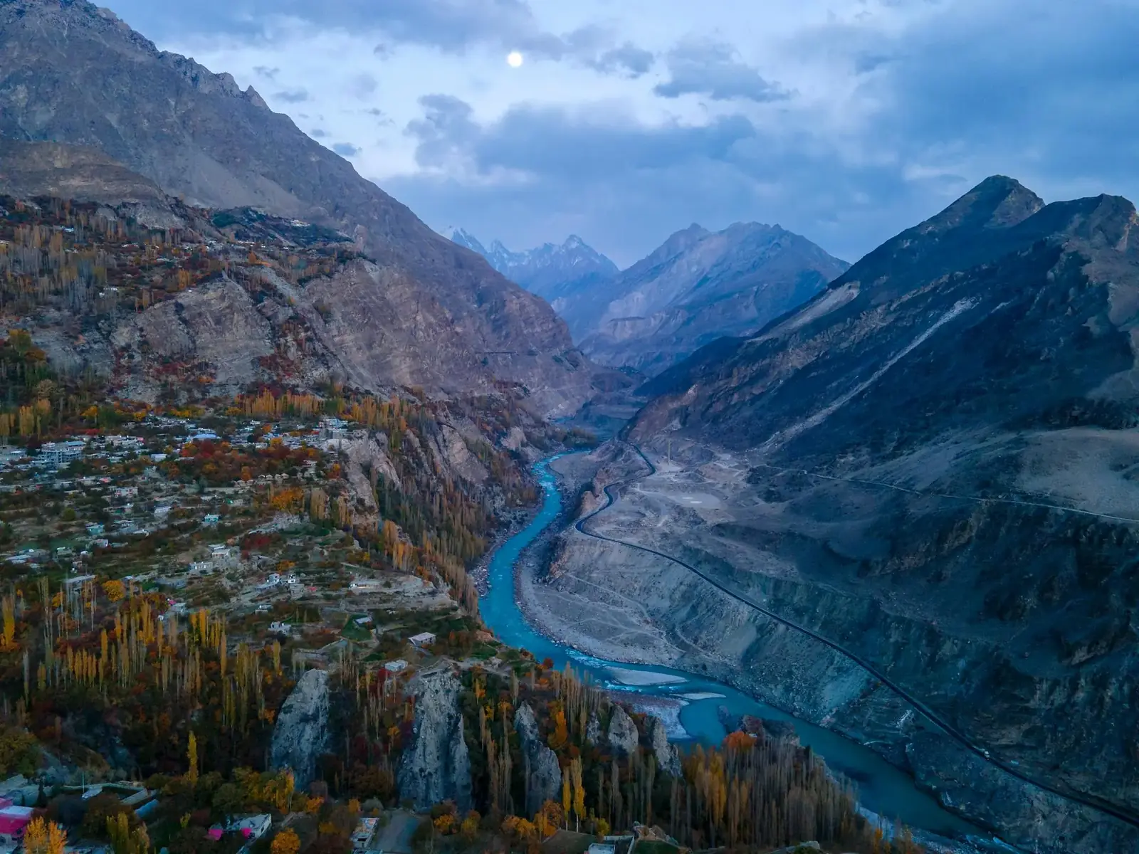 Stunning aerial view of Hunza Valley with autumn foliage and a winding river