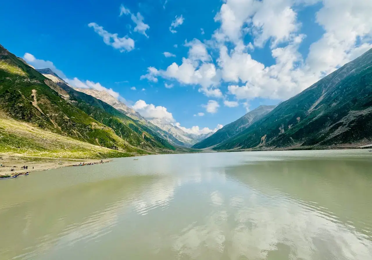 Serene lake surrounded by mountains in Naran, Pakistan